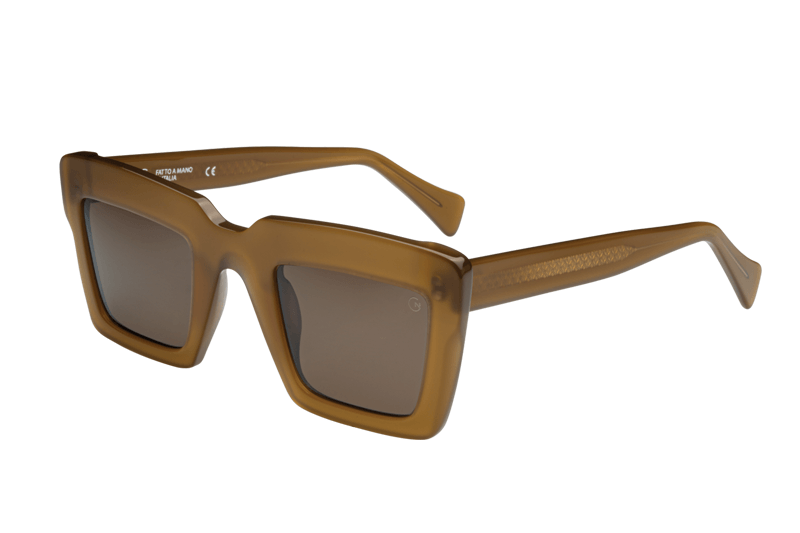 Manufacturing since 1954, Giorgio Nannini's raw textures combine with polished acetate for multi-dimensional sunglasses and spectacles from this Italian powerhouse, in a range of earthy and bright colourways. Gemma features a chunky, angular frame front in a subtle catseye shape, and comes in a rich Mustard colourway with Category 3 brown tinted lenses.