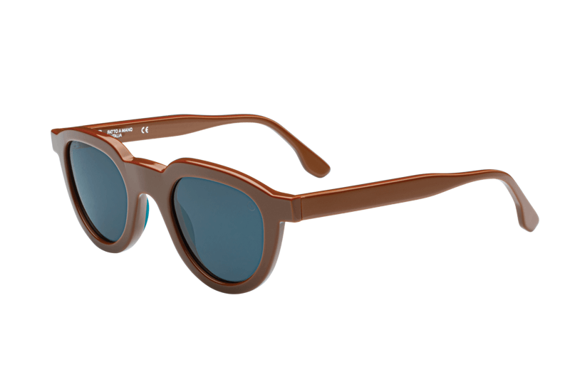 Manufacturing since 1954, Giorgio Nannini's raw textures combine with polished acetate for multi-dimensional sunglasses and spectacles from this Italian powerhouse, in a range of earthy and bright colourways. Ivo features a round lens shape with a gently angular frame front, and comes in a Caramel Brown colourway with Category 3 grey tinted lenses.