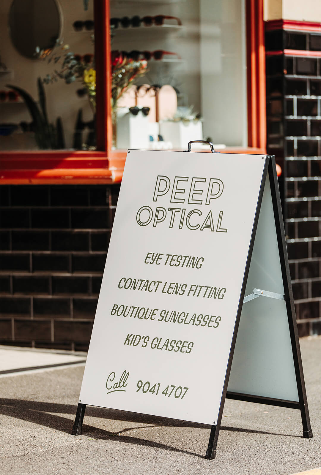 A shop sign out the front of the Peep Optical boutique eyewear store in Yarraville.