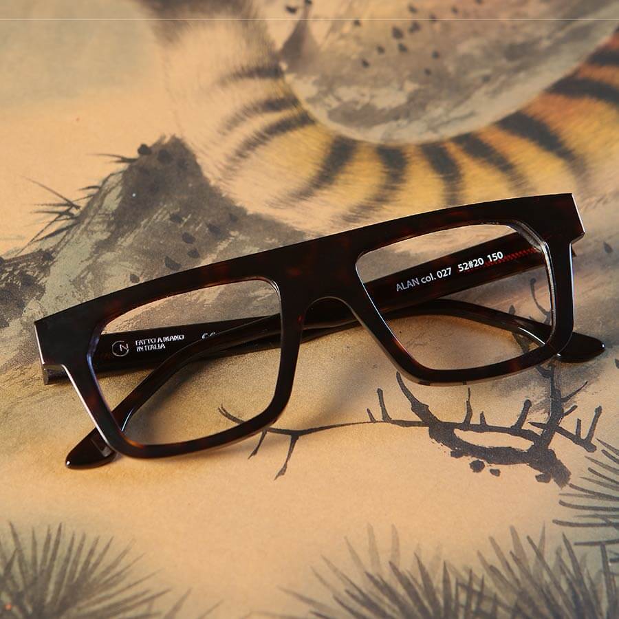 A pair of black designer Giorgio Nannini glasses with classic acetate frames.