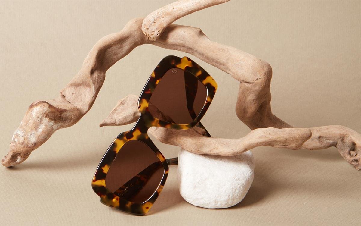 A pair of designer Giorgio Nannini glasses with chunky tortoiseshell frames.